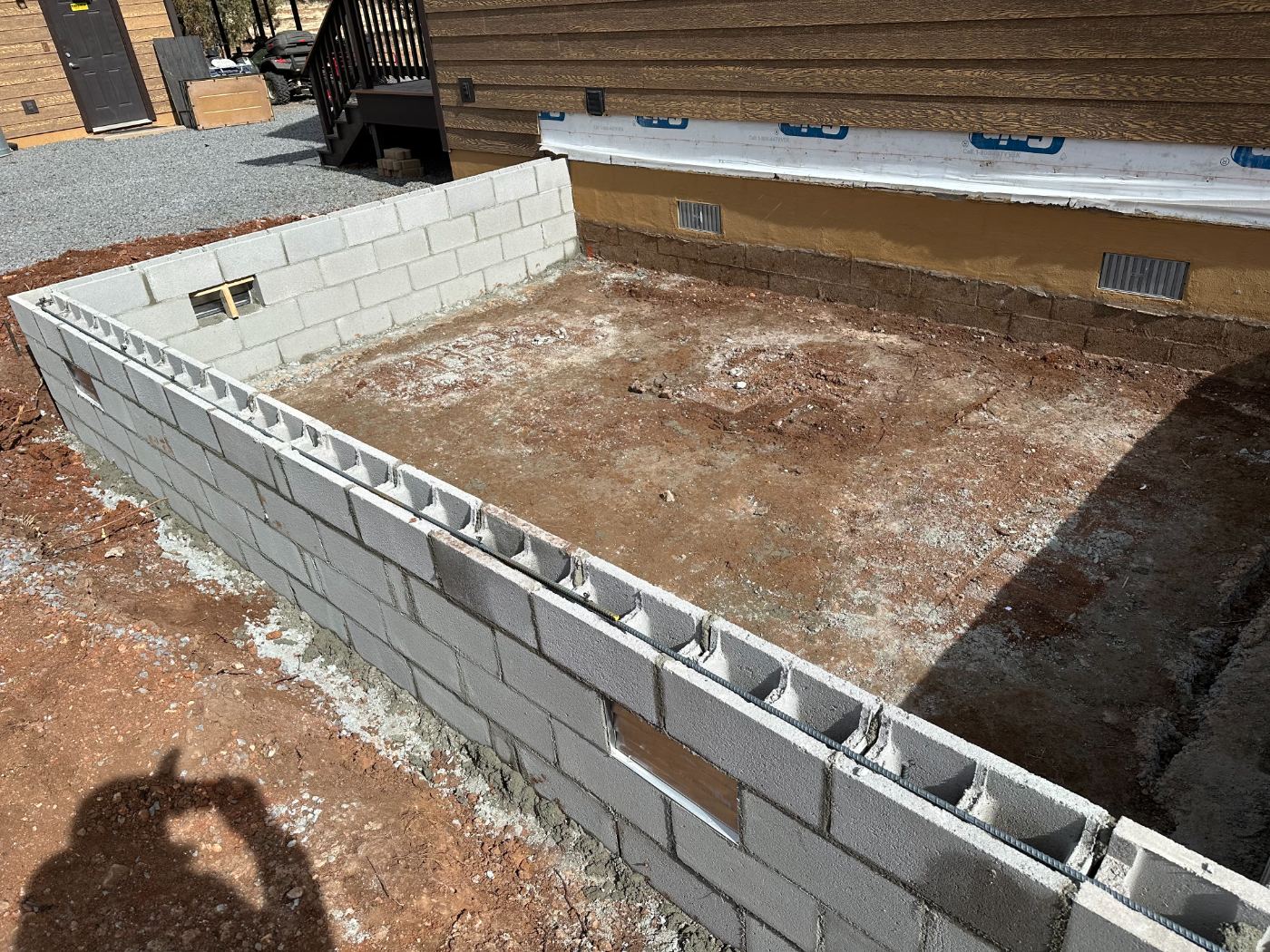 Reinforced block foundation walls for an addition