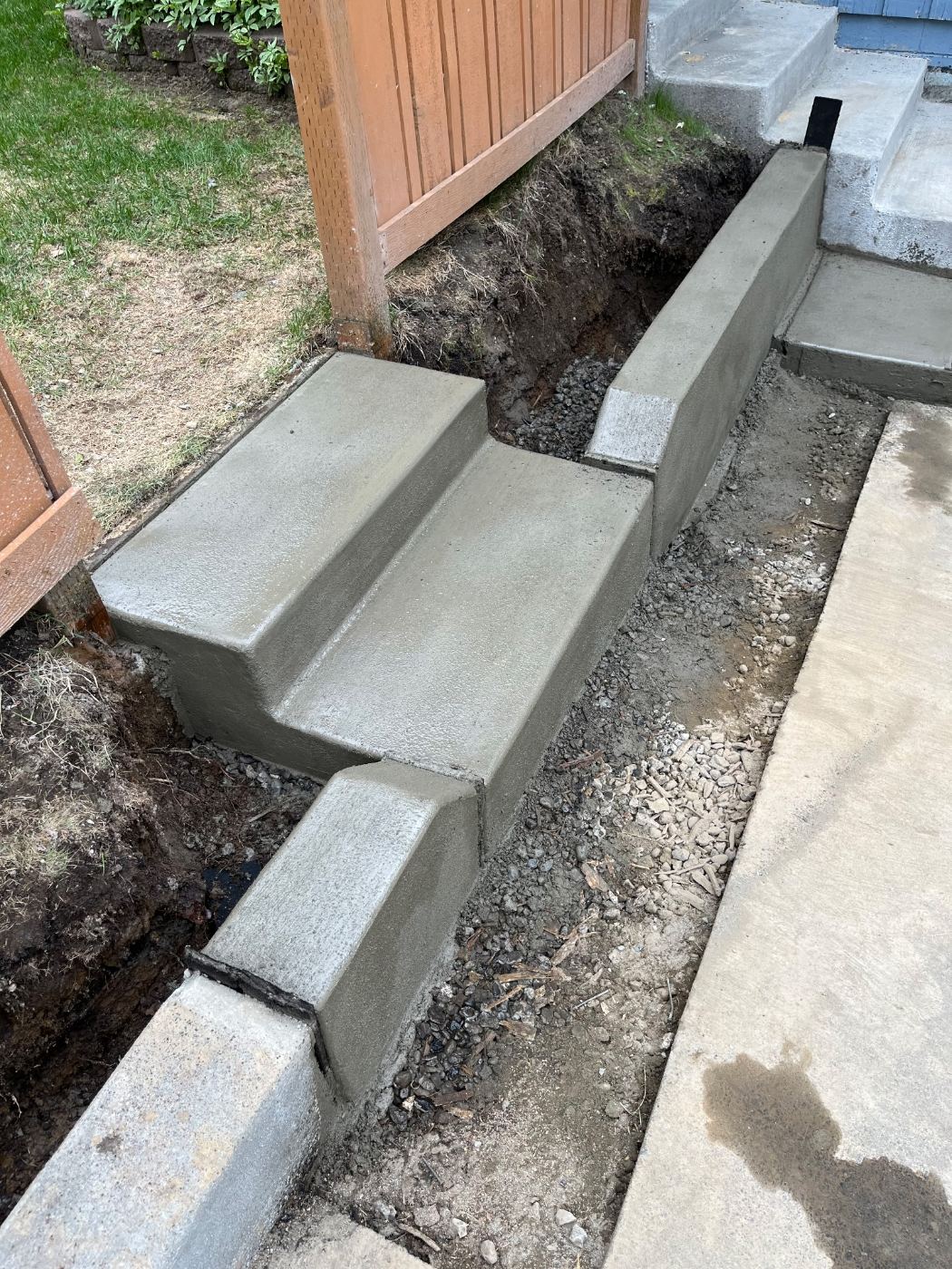 Close-up of new concrete steps and curb