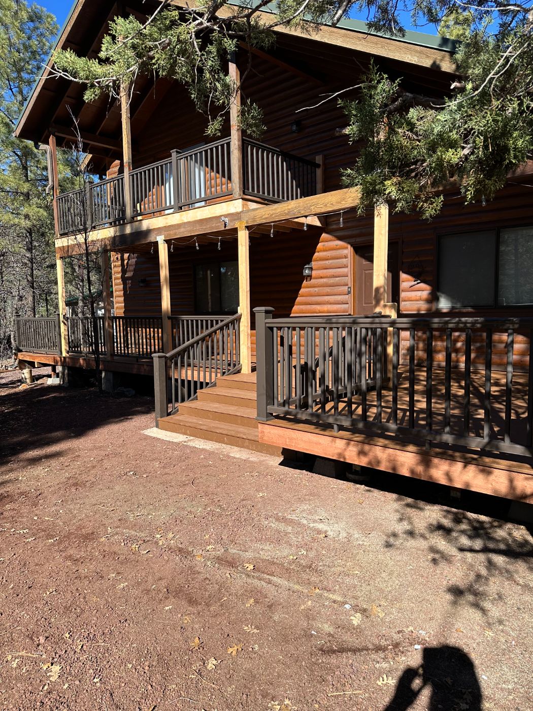 Wraparound deck and stairs on a log home