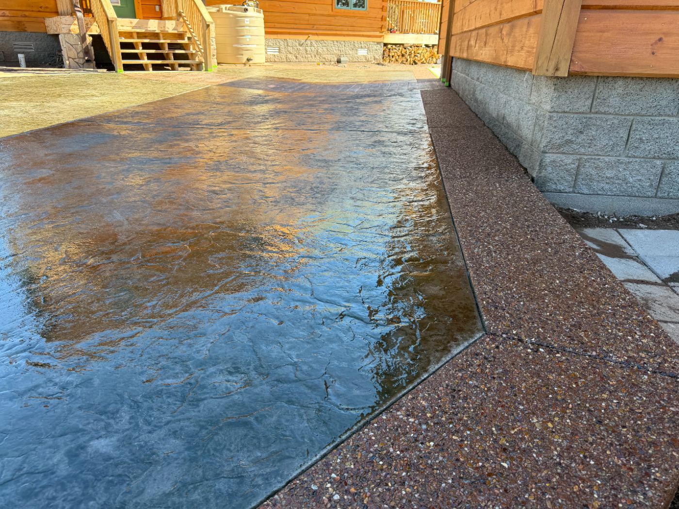 Stamped concrete patio with exposed aggregate border